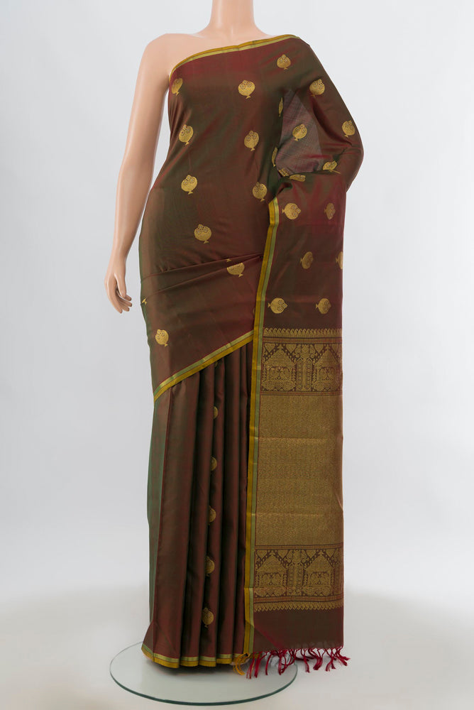 Mehandi Green Kanjivaram Silk Saree with Zari Butta on the body and Silk Border.  displayed on a mannequin