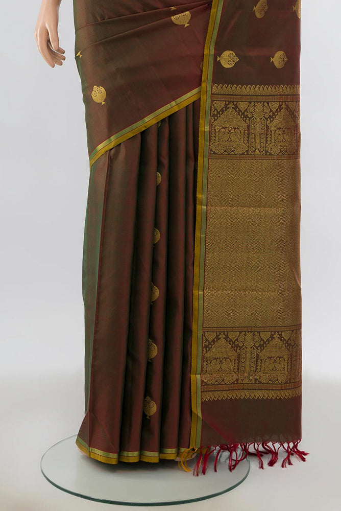 Pleats and pallu of Mehandi Green Kanjivaram Silk Saree with Zari Butta on the body and Silk Border. 