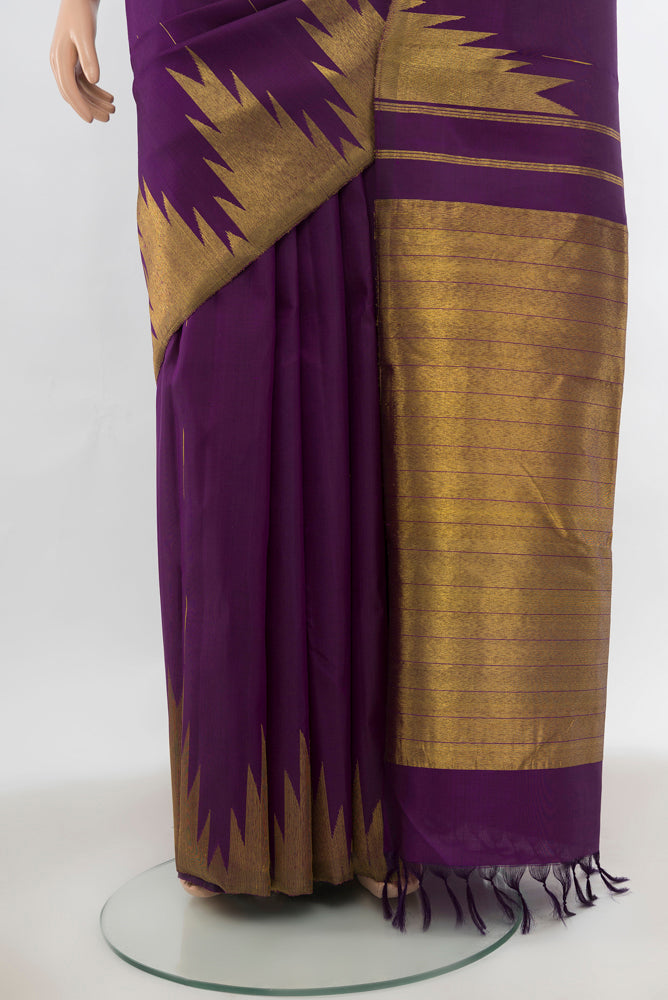 Pleats and pallu of Violet Kanjivaram Silk Saree with Zari Butta on the body and Silk Border. 