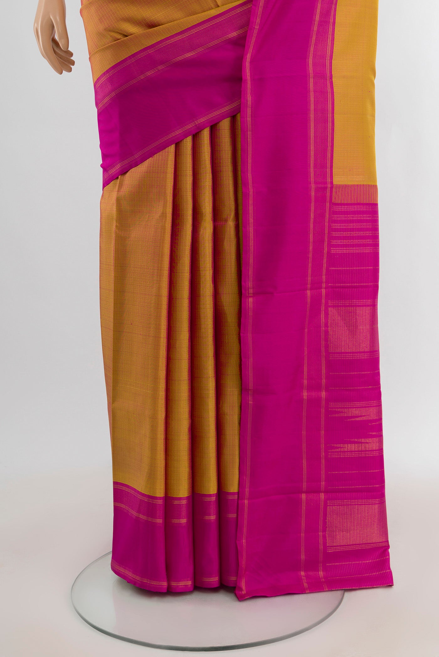 Pleats and pallu of Mustard Kanchipuram Silk Saree with Checked design on the body and Plain Border. 