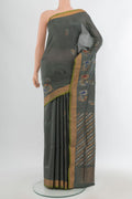 Grey Uppada Silk Saree with Zari Butta on the body and Zari Border.  displayed on a mannequin