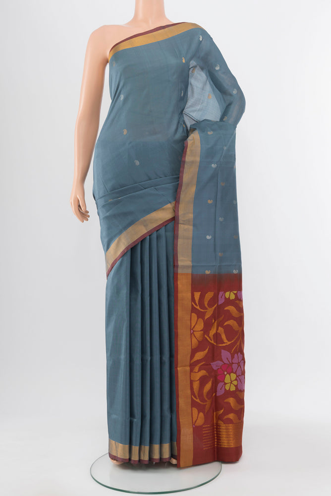 Grey Uppada Silk Saree with Zari Butta on the body and Silk Border.  displayed on a mannequin
