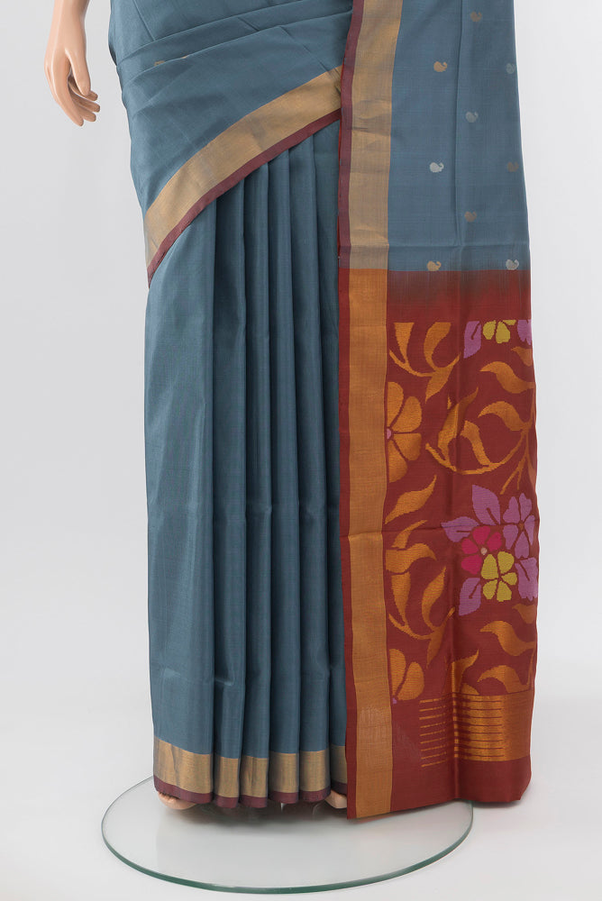 Pleats and pallu of Grey Uppada Silk Saree with Zari Butta on the body and Silk Border. 