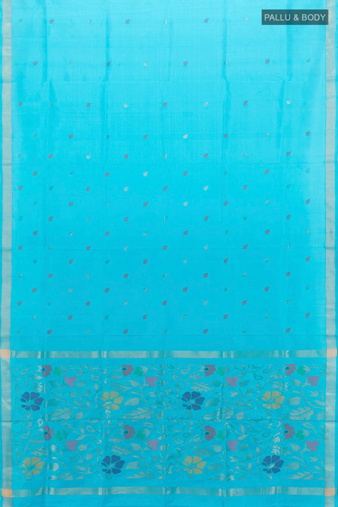 Flat view of Light Blue Uppada Silk Saree with Zari Butta on the body and Silk Border. 