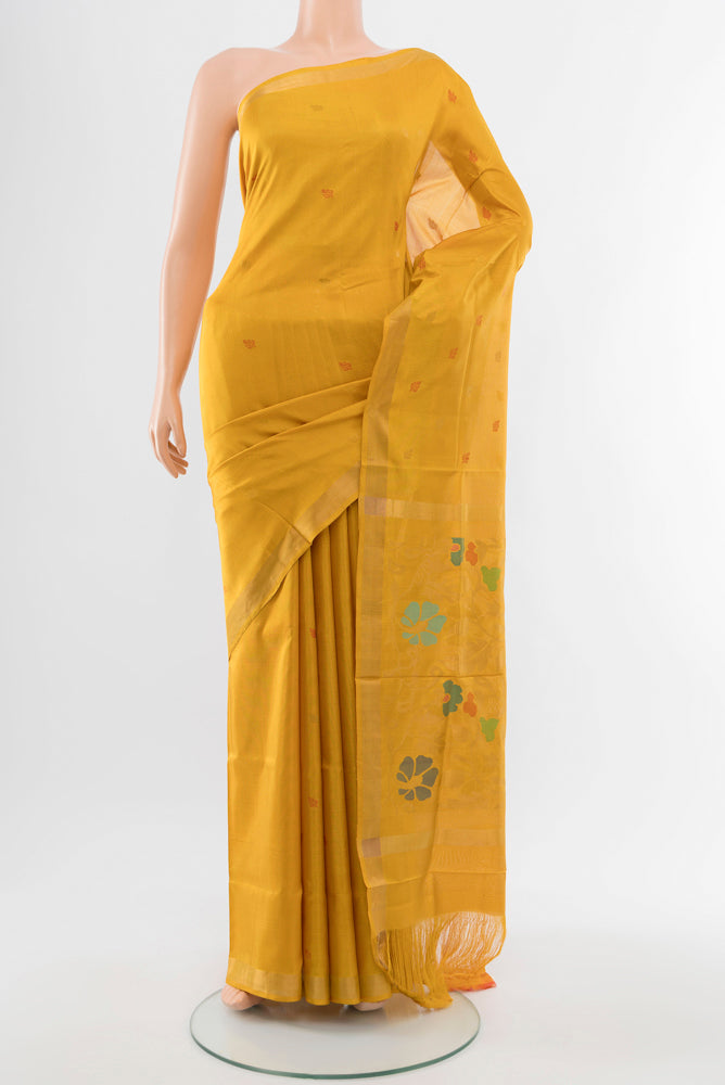 Mustard Uppada Silk Saree with Zari Butta on the body and Silk Border.  displayed on a mannequin