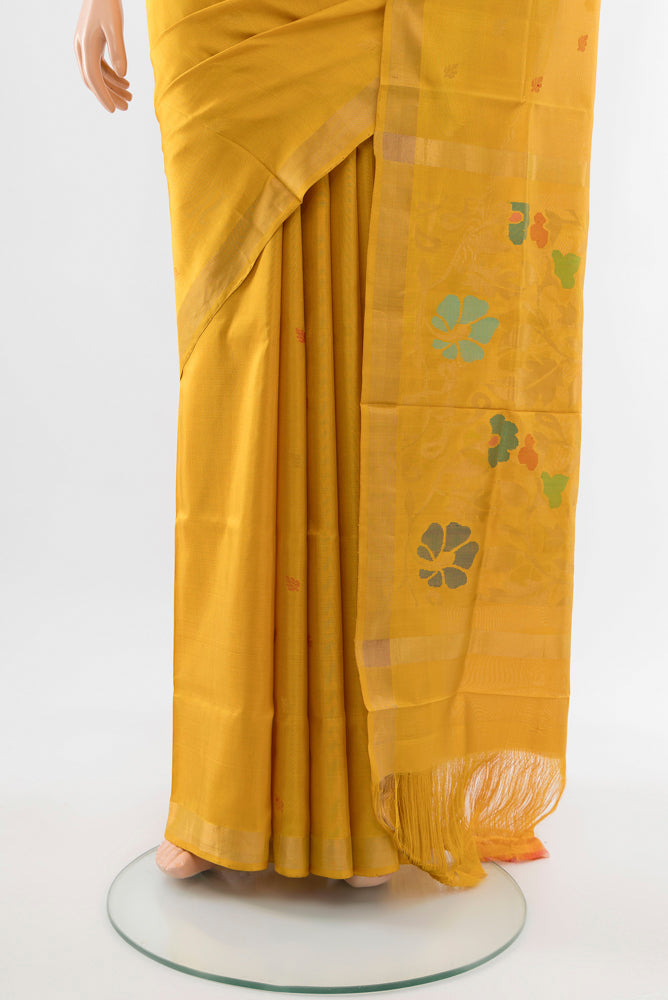 Pleats and pallu of Mustard Uppada Silk Saree with Zari Butta on the body and Silk Border. 