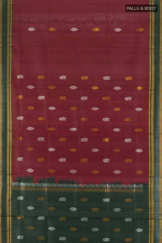 Flat view of Pure Silk Pure Zari Maroon Uppada Saree with Zari Butta on the body and Silk Border. 