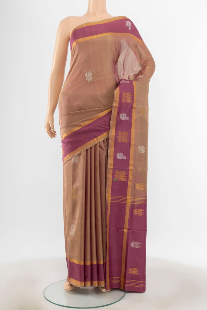 Olive Green Uppada Silk Saree with Zari Butta on the body and Silk Border.  displayed on a mannequin