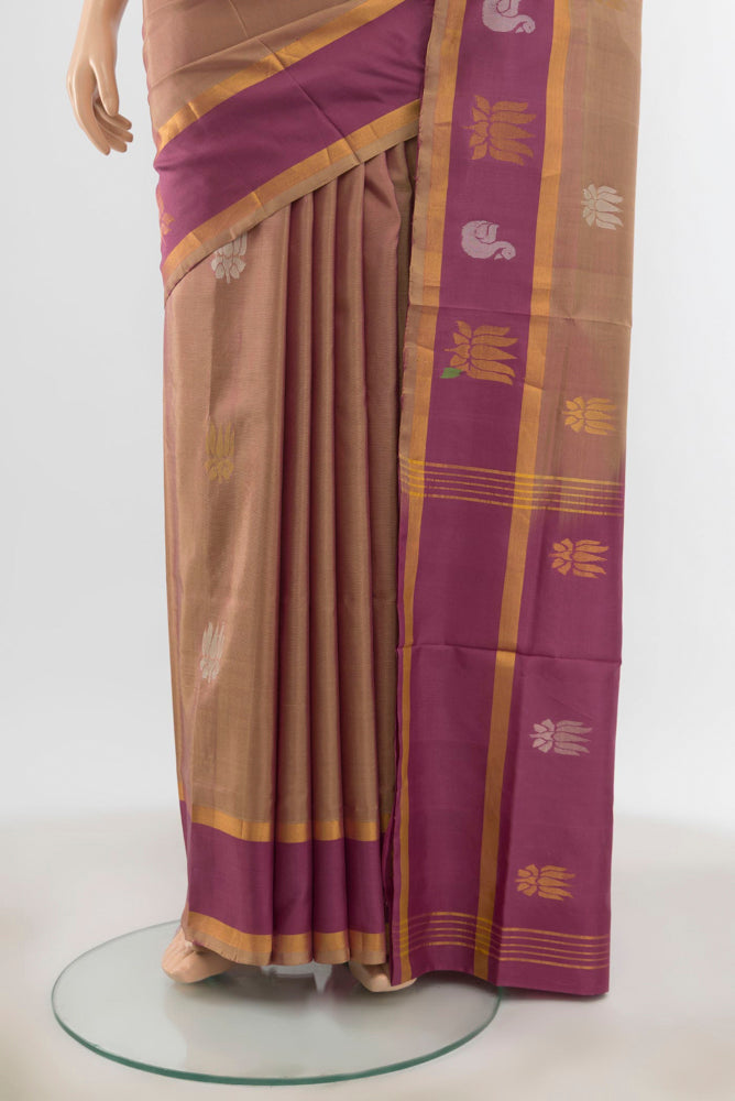 Pleats and pallu of Olive Green Uppada Silk Saree with Zari Butta on the body and Silk Border. 