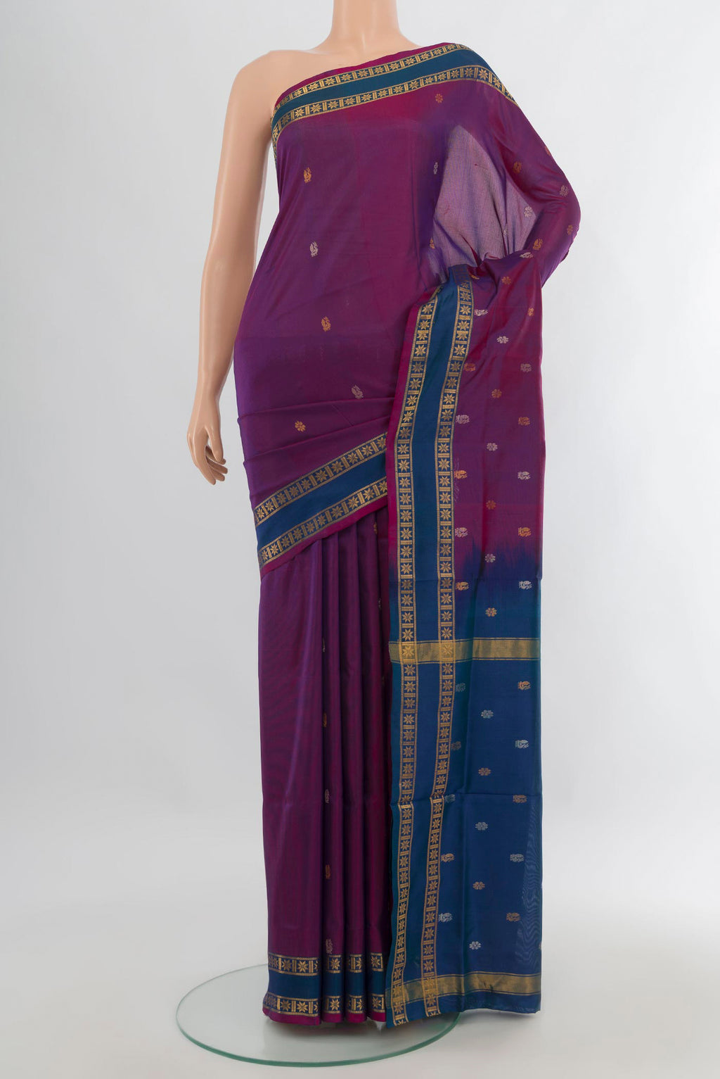 Pure Silk Magenta Uppada Saree with Zari Butta on the body and Plain Border.  displayed on a mannequin