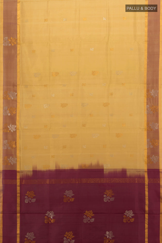 Flat view of Beige Uppada Silk Saree with Zari Butta on the body and Silk Border. 
