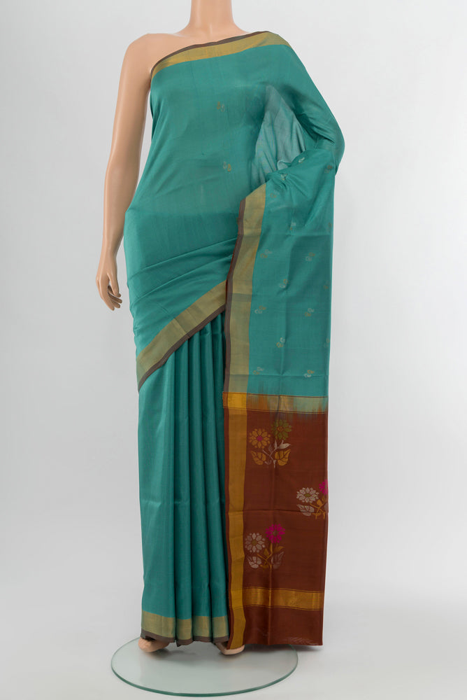 Blue Grey Uppada Silk Saree with Zari Butta on the body and Silk Border.  displayed on a mannequin