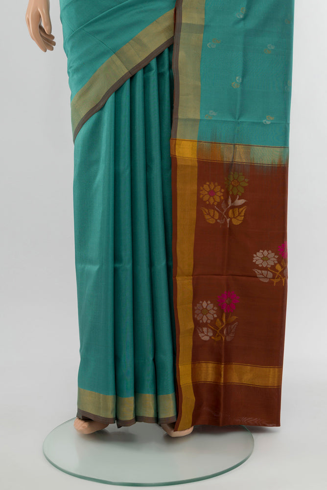 Pleats and pallu of Blue Grey Uppada Silk Saree with Zari Butta on the body and Silk Border. 