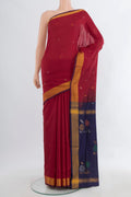 Pure Silk Maroon Uppada Saree with Zari Butta on the body and Zari Border.  displayed on a mannequin