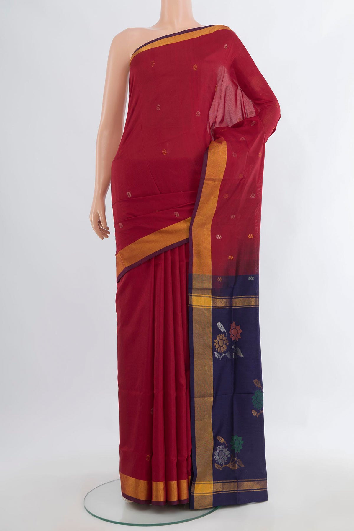 Pure Silk Maroon Uppada Saree with Zari Butta on the body and Zari Border.  displayed on a mannequin