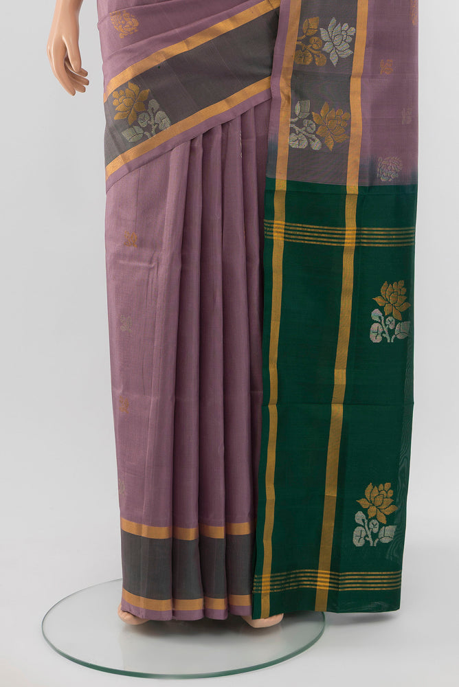 Pleats and pallu of Bronze Uppada Silk Saree with Zari Butta on the body and Silk Border. 