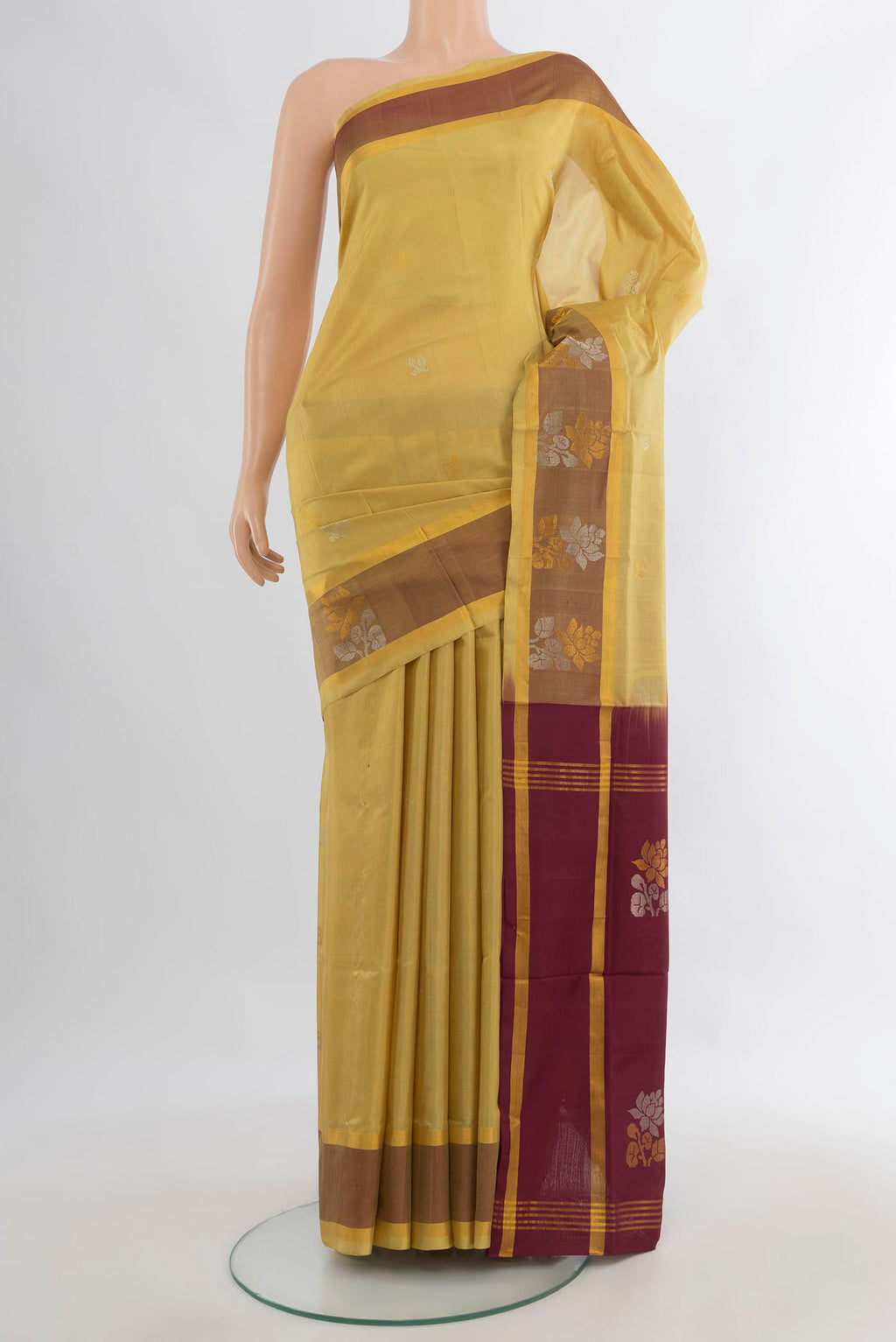 Pure Silk Sandal Uppada Saree with Zari Butta on the body and Plain Border.  displayed on a mannequin