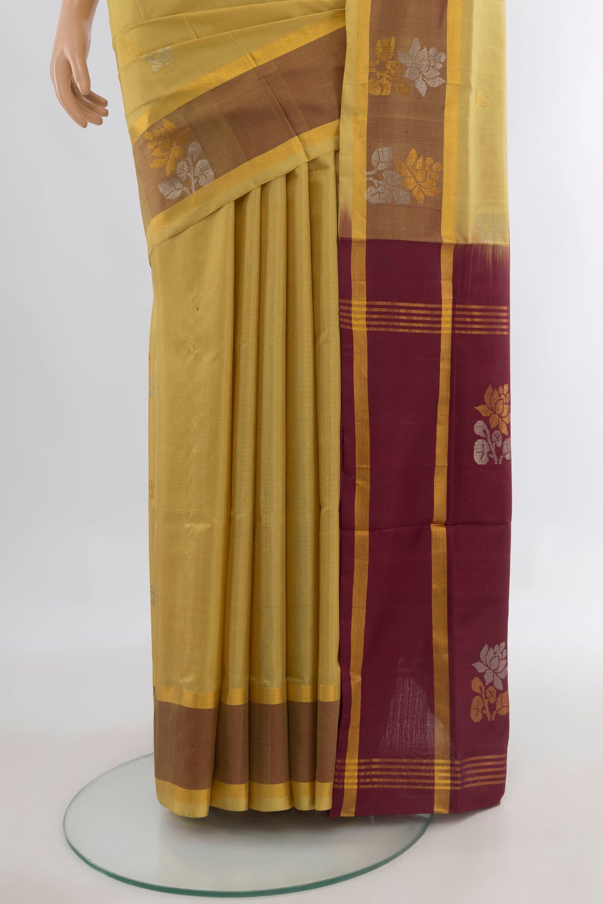 Pleats and pallu of Pure Silk Sandal Uppada Saree with Zari Butta on the body and Plain Border. 