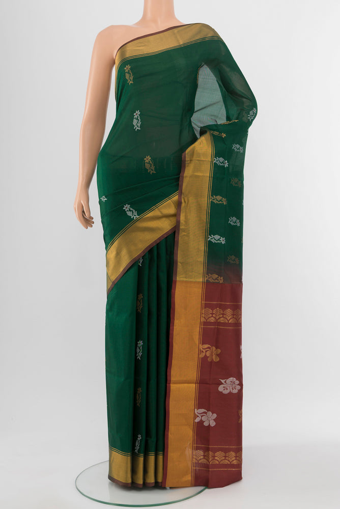 Mint Green Uppada Silk Saree with Zari Butta on the body and Silk Border.  displayed on a mannequin