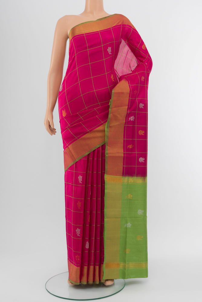 Magenta Uppada Silk Saree with Zari Brocade on the body and Silk Border.  displayed on a mannequin