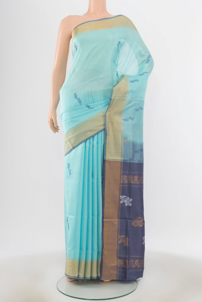 Sky Blue Uppada Silk Saree with Zari Butta on the body and Silk Border.  displayed on a mannequin