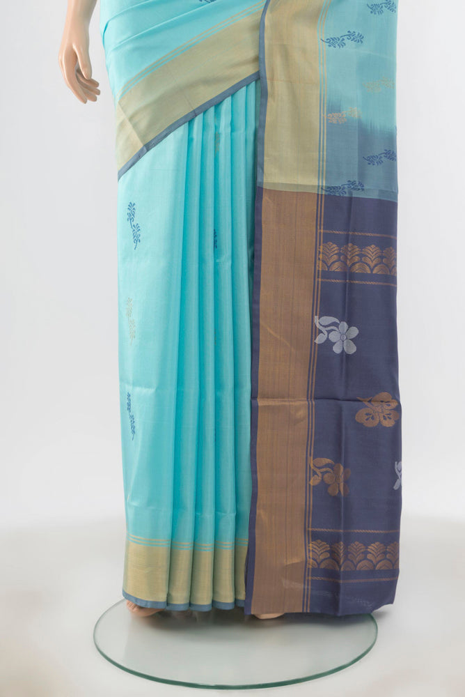 Pleats and pallu of Sky Blue Uppada Silk Saree with Zari Butta on the body and Silk Border. 