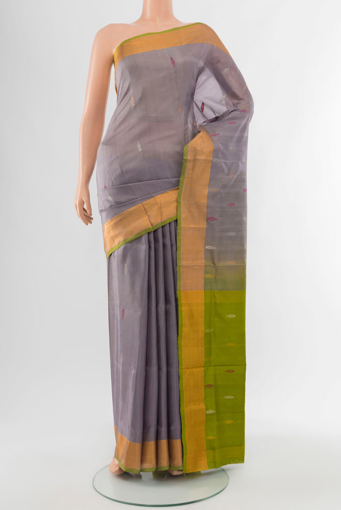 Grey Uppada Silk Saree with Zari Butta on the body and Silk Border.  displayed on a mannequin