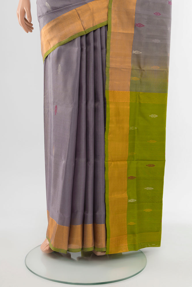 Pleats and pallu of Grey Uppada Silk Saree with Zari Butta on the body and Silk Border. 