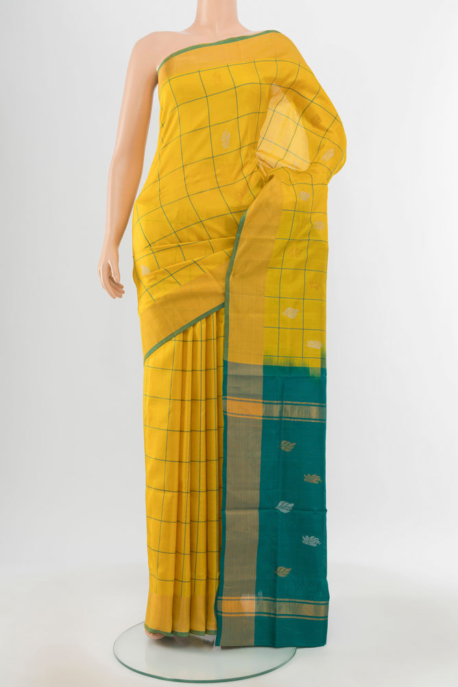 Yellow Uppada Silk Saree with Zari Butta on the body and Silk Border.  displayed on a mannequin