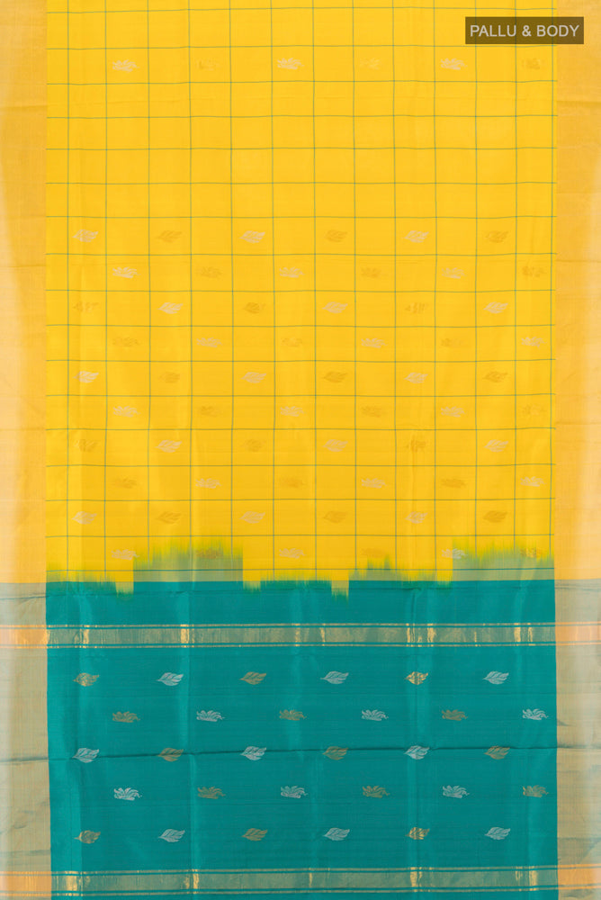 Flat view of Yellow Uppada Silk Saree with Zari Butta on the body and Silk Border. 