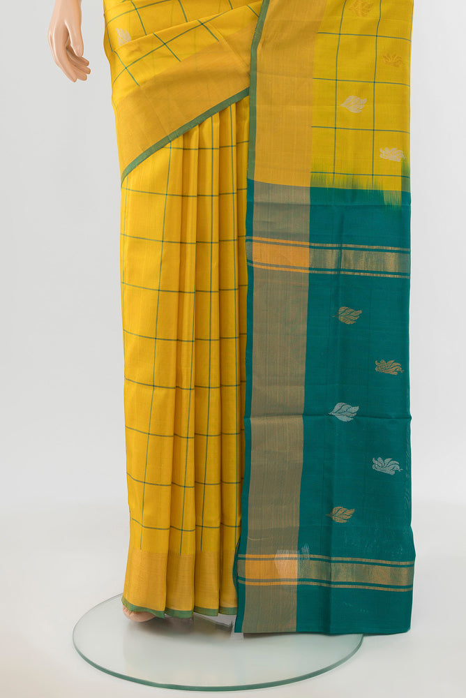 Pleats and pallu of Yellow Uppada Silk Saree with Zari Butta on the body and Silk Border. 