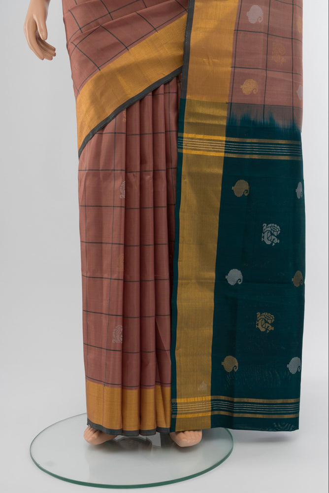 Pleats and pallu of Bronze Uppada Silk Saree with Zari Butta on the body and Silk Border. 