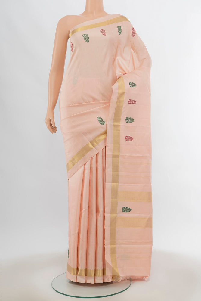 Rose Gold Kanchipuram Silk Saree with Zari Butta on the body and Silk Border.  displayed on a mannequin