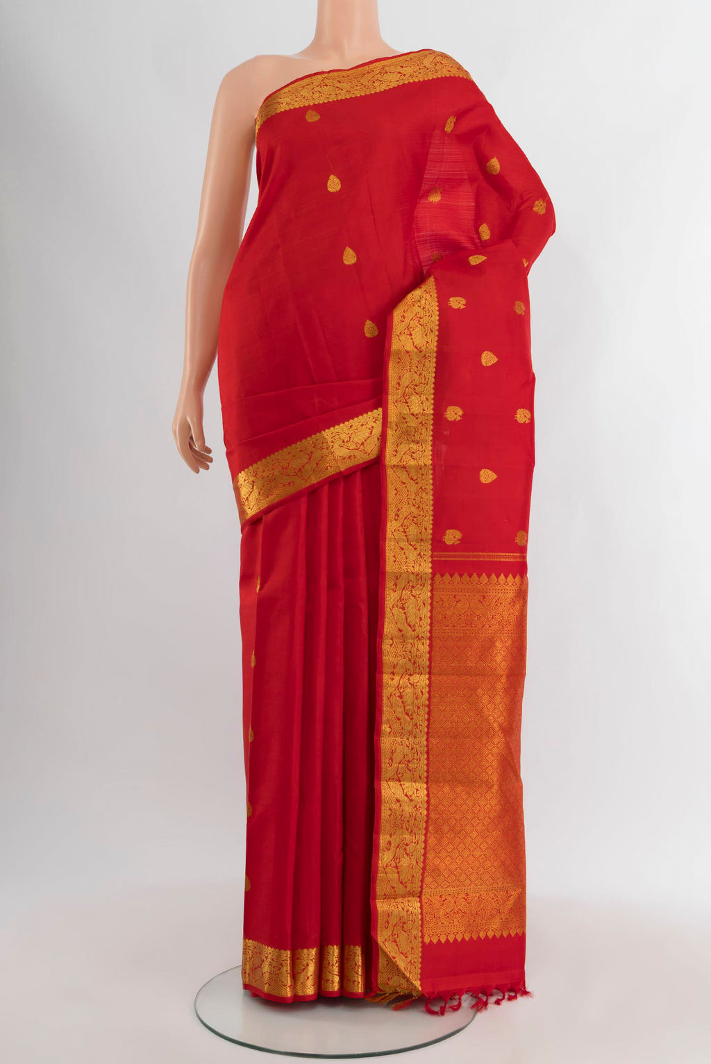 Red Kanjivaram Silk Saree with Zari Butta on the body and Zari Border.  displayed on a mannequin