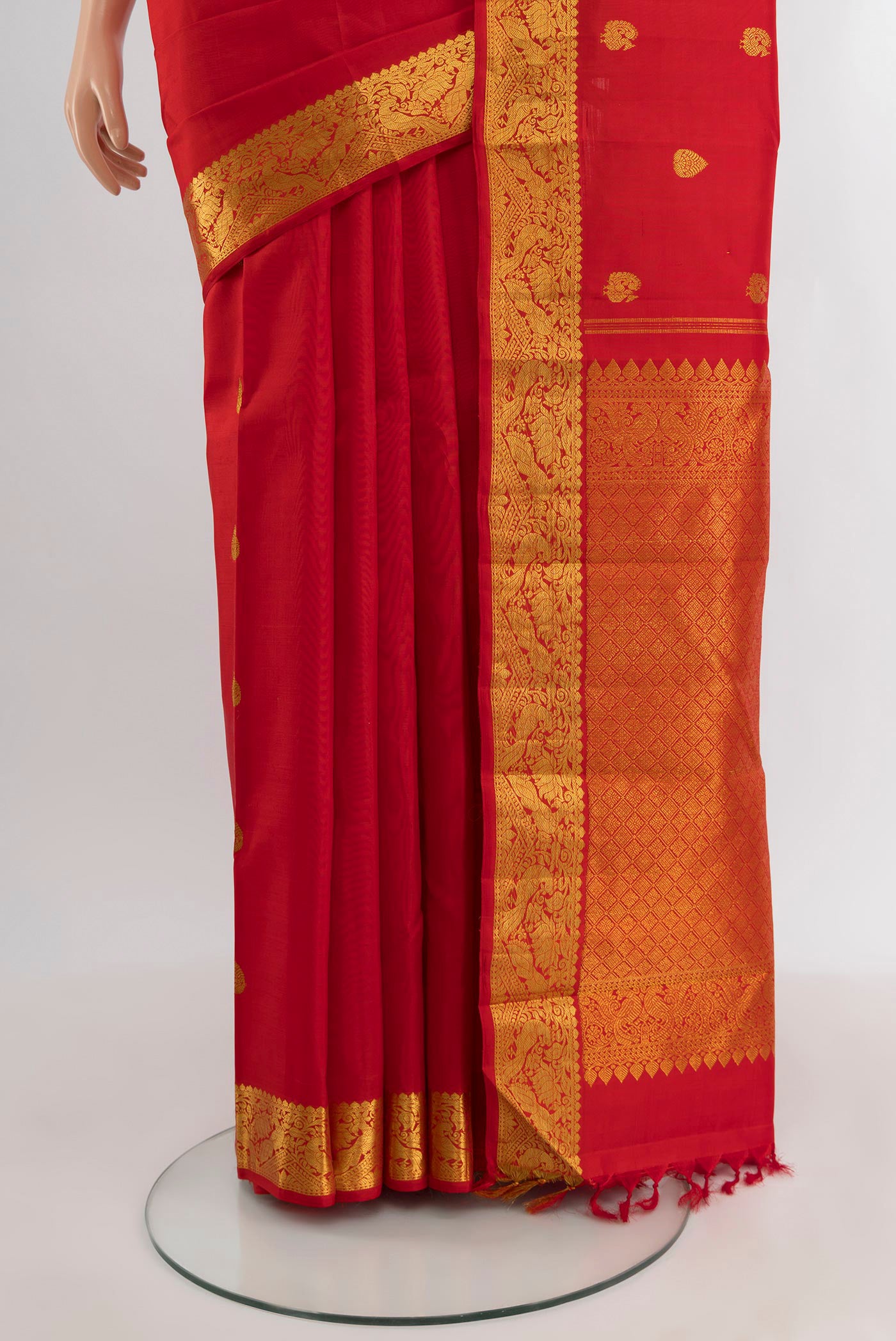 Pleats and pallu of Red Kanjivaram Silk Saree with Zari Butta on the body and Zari Border. 