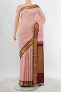 Pure Silk Pure Zari Rose Gold Kanjivaram Saree with Zari Butta on the body and Silk Border.  displayed on a mannequin