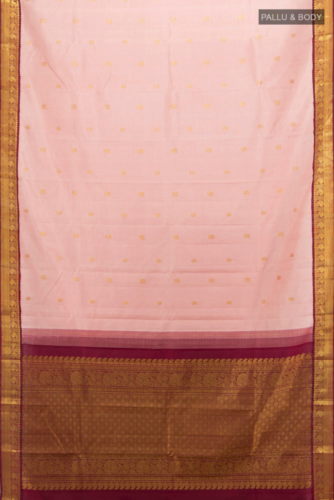 Flat view of Pure Silk Pure Zari Rose Gold Kanjivaram Saree with Zari Butta on the body and Silk Border. 