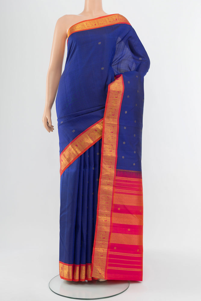 Dark Blue Kanjivaram Silk Saree with Zari Butta on the body and Silk Border.  displayed on a mannequin