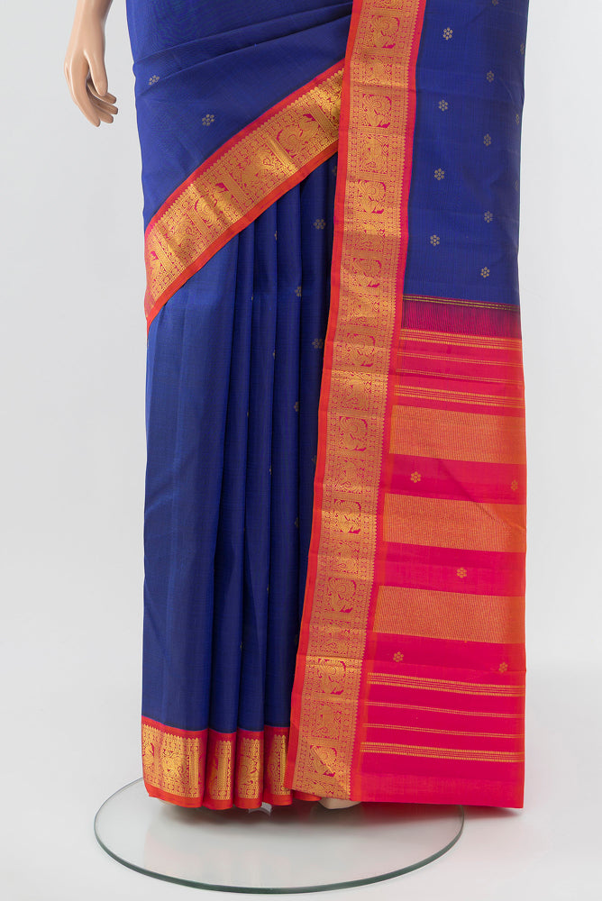 Pleats and pallu of Dark Blue Kanjivaram Silk Saree with Zari Butta on the body and Silk Border. 