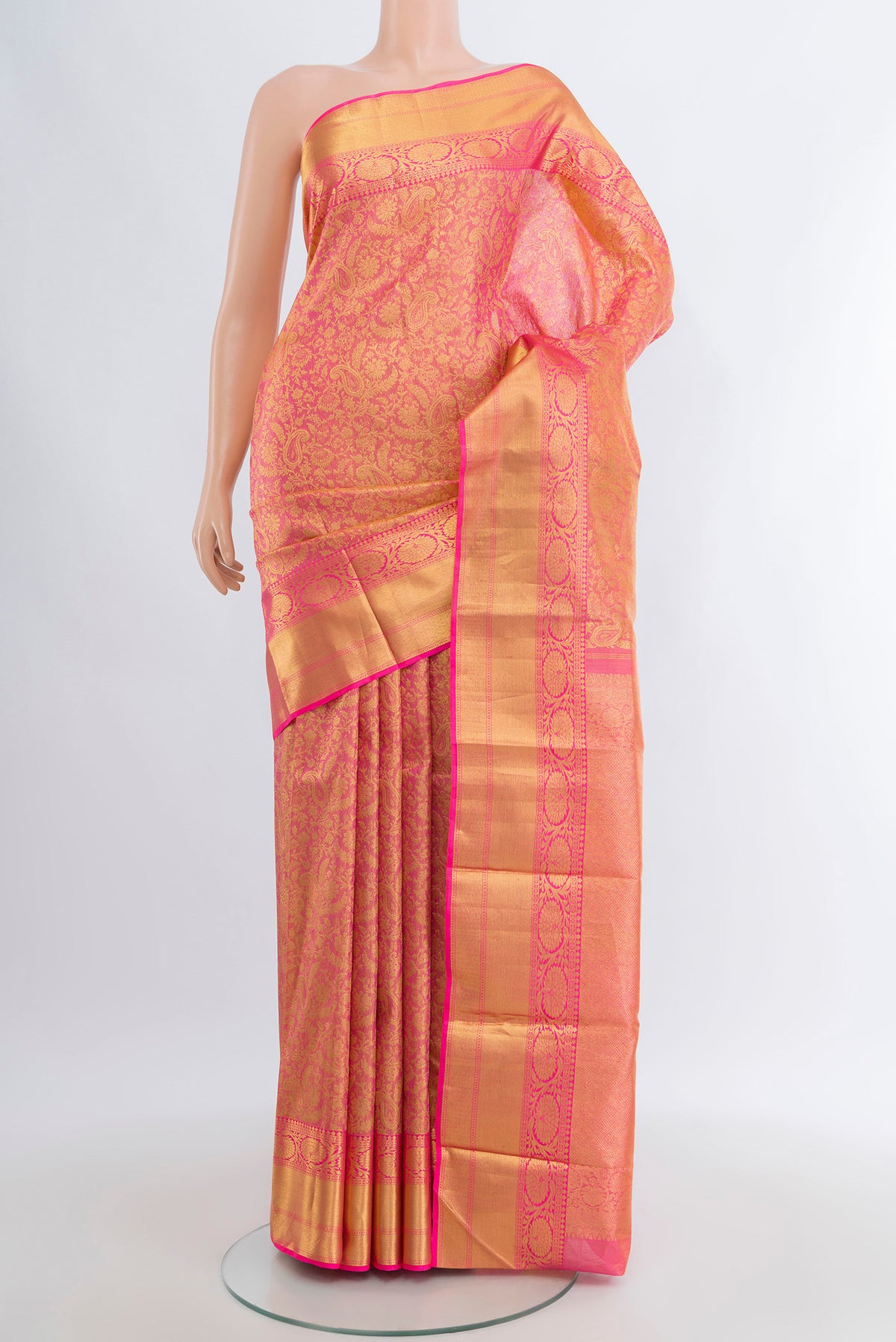 Rose pink Kanchipuram Silk Saree with Zari Brocade on the body and Zari Border.  displayed on a mannequin