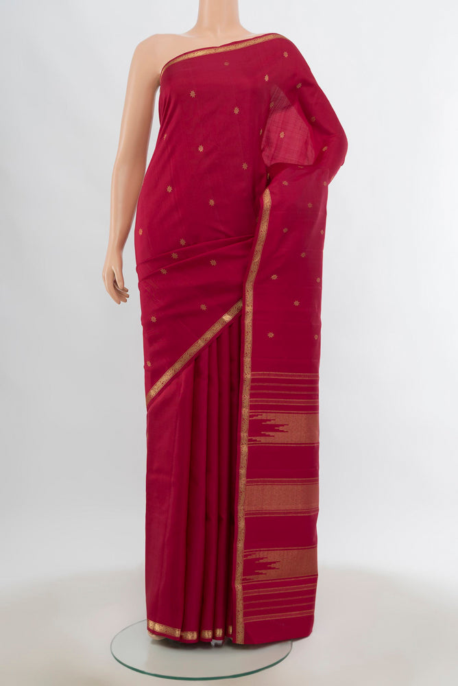 Pure Silk Pure Zari Maroon Kanchipuram Saree with Zari Butta on the body and Silk Border.  displayed on a mannequin