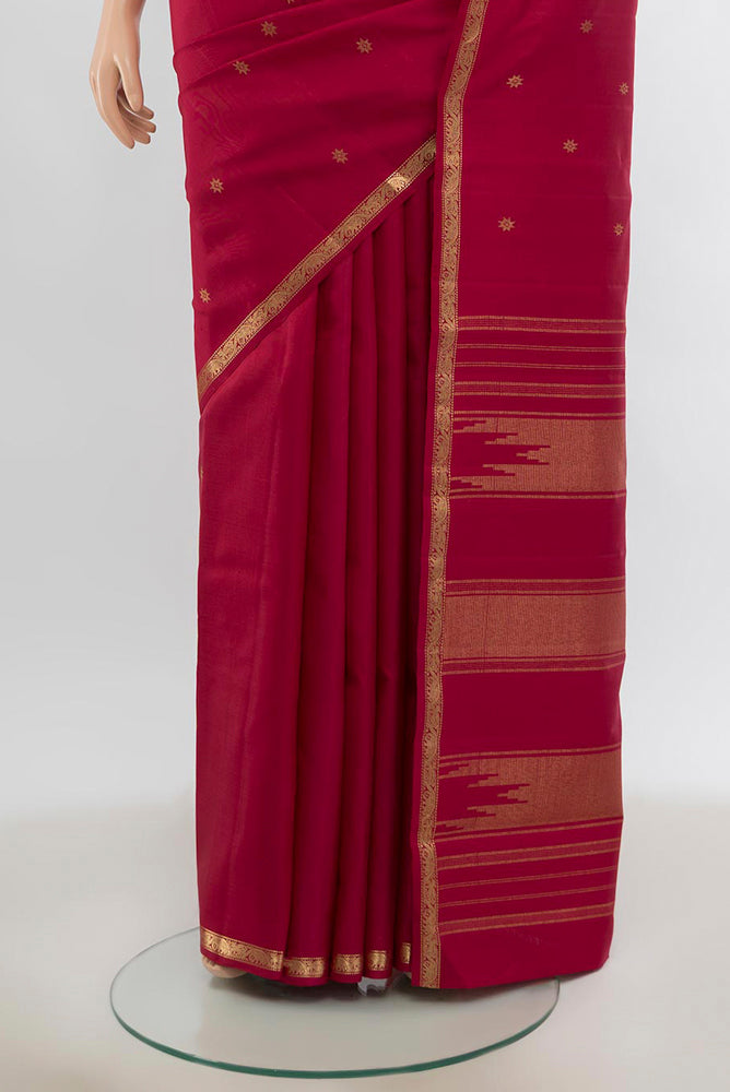 Pleats and pallu of Pure Silk Pure Zari Maroon Kanchipuram Saree with Zari Butta on the body and Silk Border. 