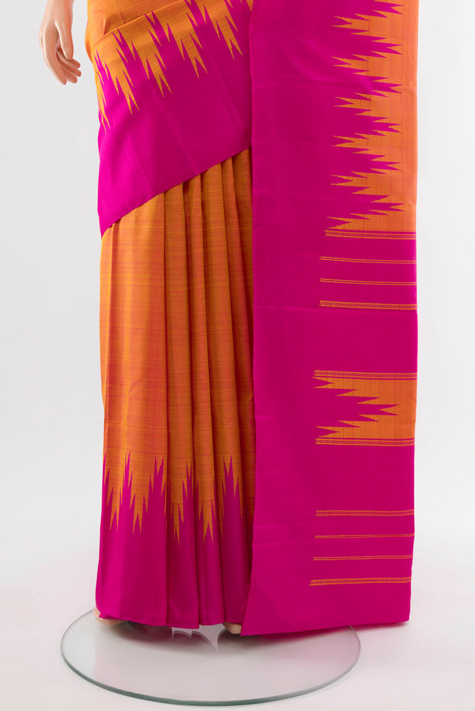 Pleats and pallu of Pure Silk Pure Zari Peach Kanjivaram Saree with Zari Butta on the body and Silk Border. 