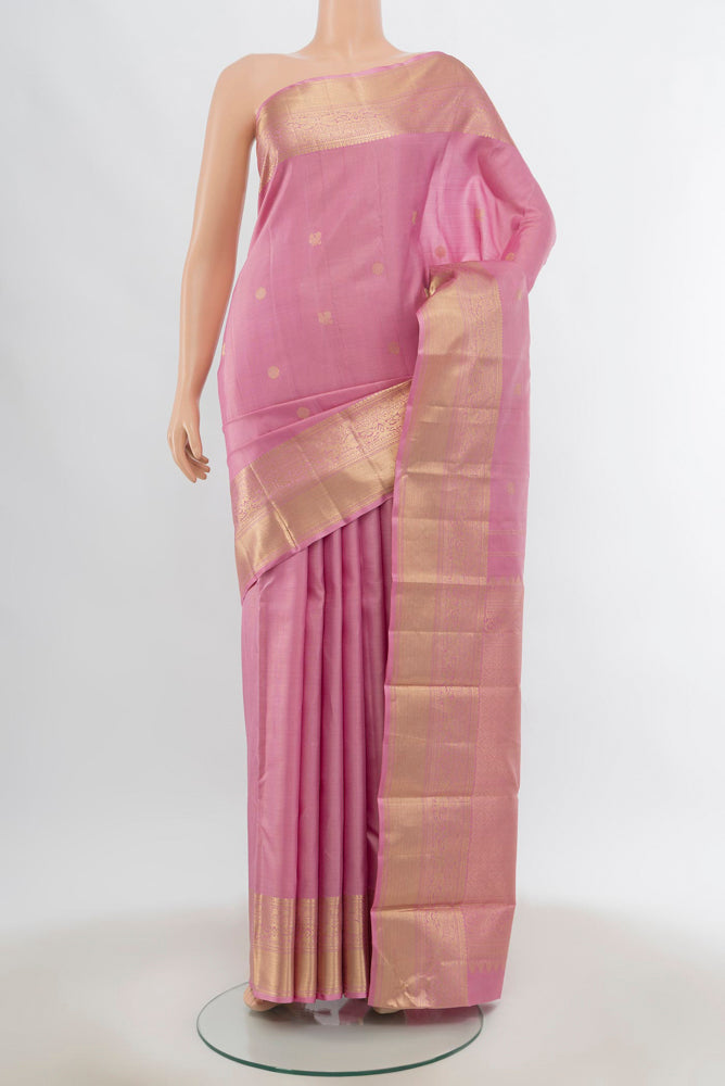 Rose pink Kanjivaram Silk Saree with Zari Butta on the body and Silk Border.  displayed on a mannequin