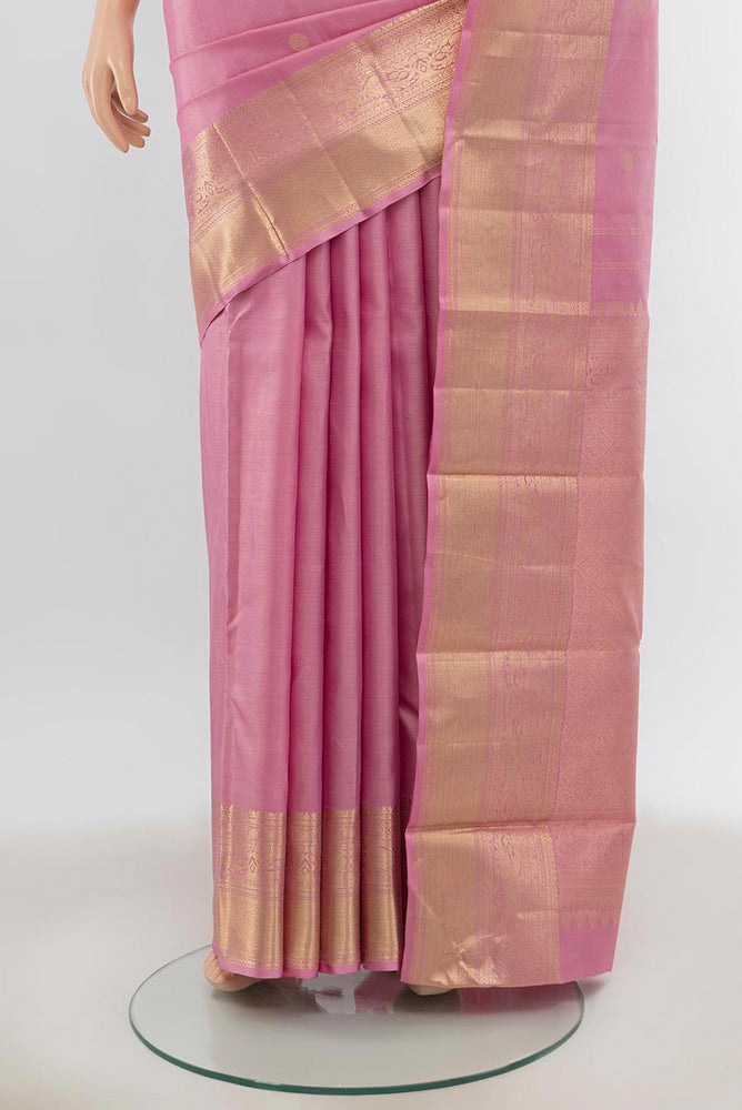 Pleats and pallu of Rose pink Kanjivaram Silk Saree with Zari Butta on the body and Silk Border. 