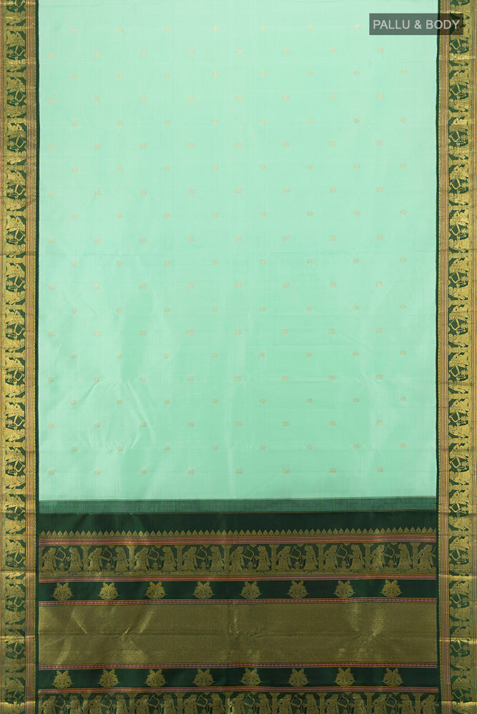 Flat view of Light Green Kanjivaram Silk Saree with Zari Butta on the body and Silk Border. 