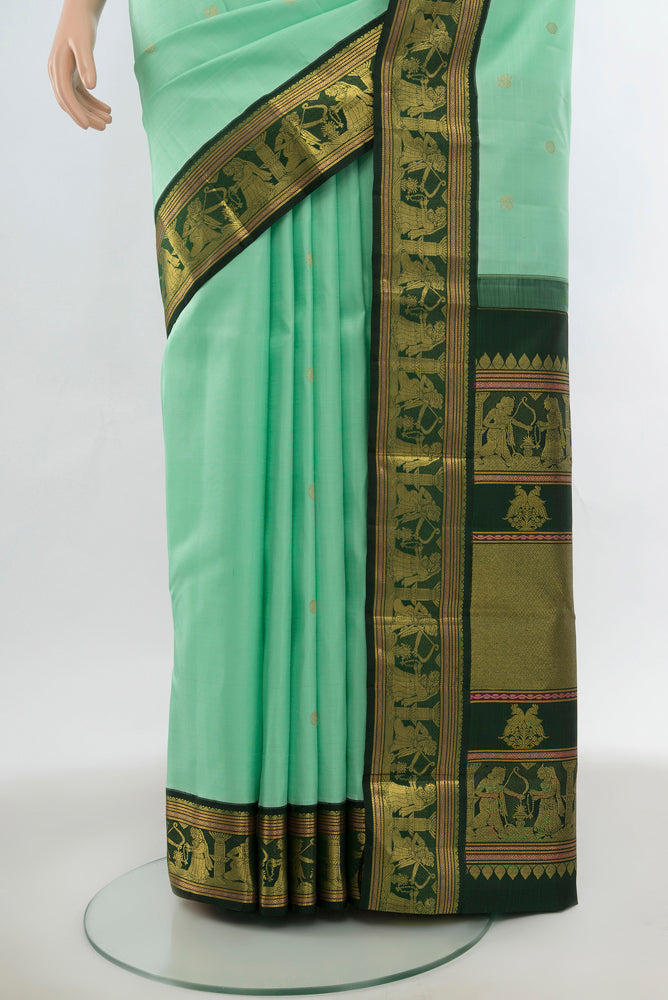Pleats and pallu of Light Green Kanjivaram Silk Saree with Zari Butta on the body and Silk Border. 