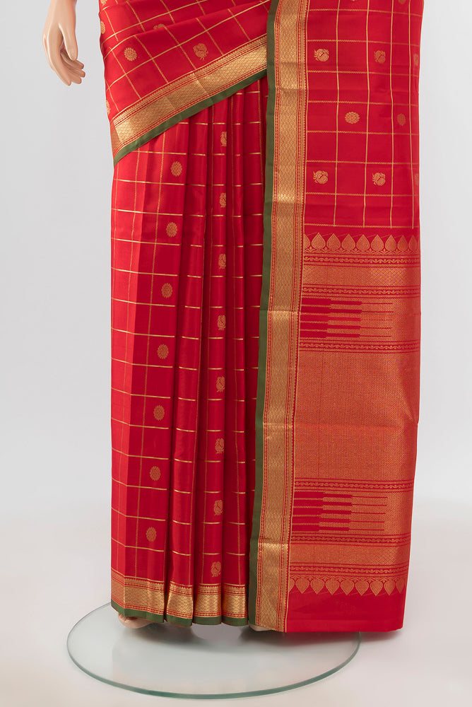 Pleats and pallu of Pure Silk Pure Zari Red Kanjivaram Saree with Zari Butta on the body and Silk Border. 