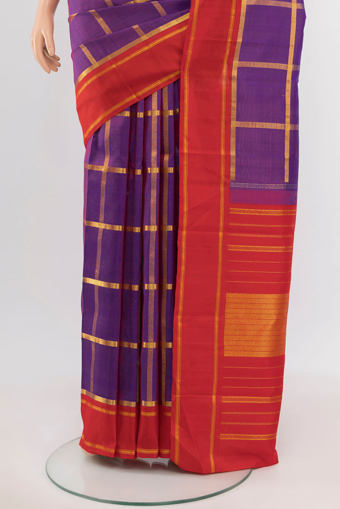Pleats and pallu of Magenta Kanchipuram Silk Saree with Zari Butta on the body and Silk Border. 