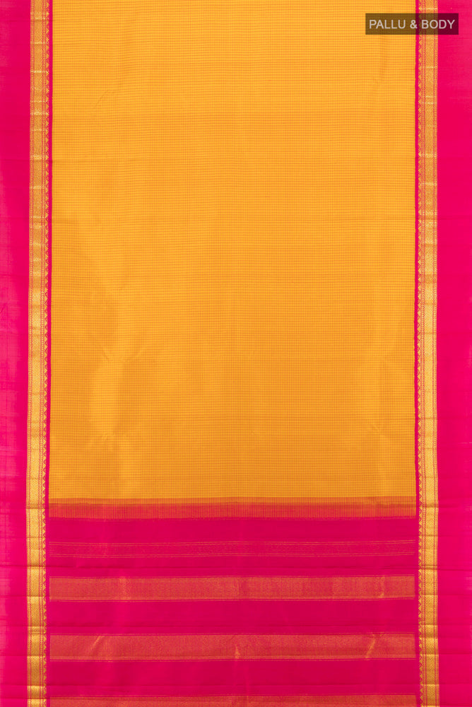 Flat view of Yellow Kanjivaram Silk Saree with Zari Butta on the body and Silk Border. 